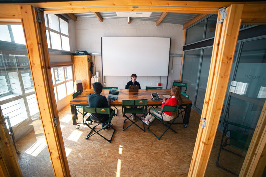 boardroom-meeting-room-on-demand-coworking-namibia Meeting in the boardroom in Desert & Ocean co-working Namibia.